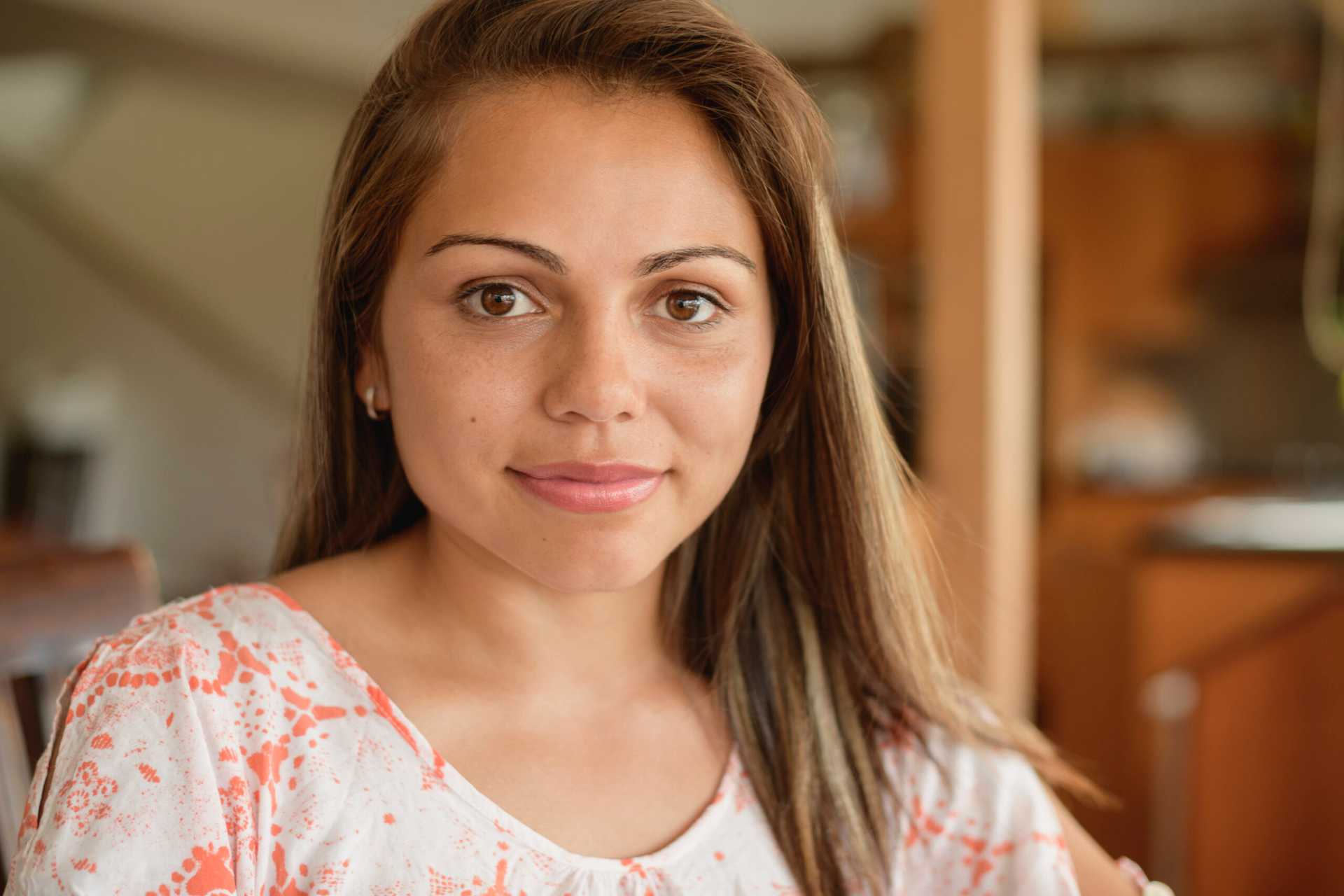Aboriginal woman looking at camera with contented expression