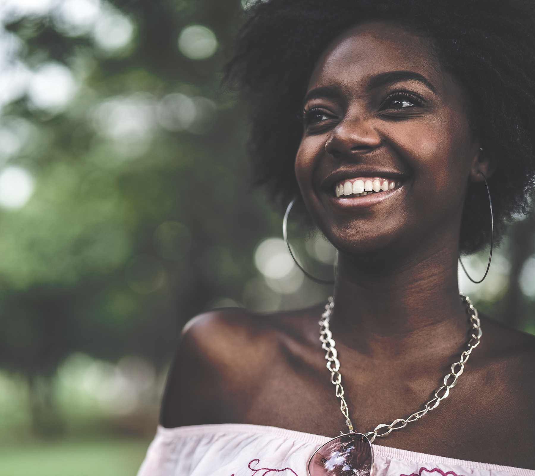 Close up of a smiling young Somalian woman.