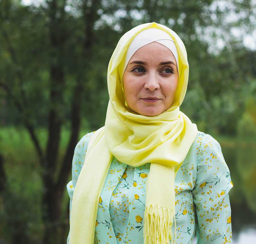 A muslim woman stares into the distance