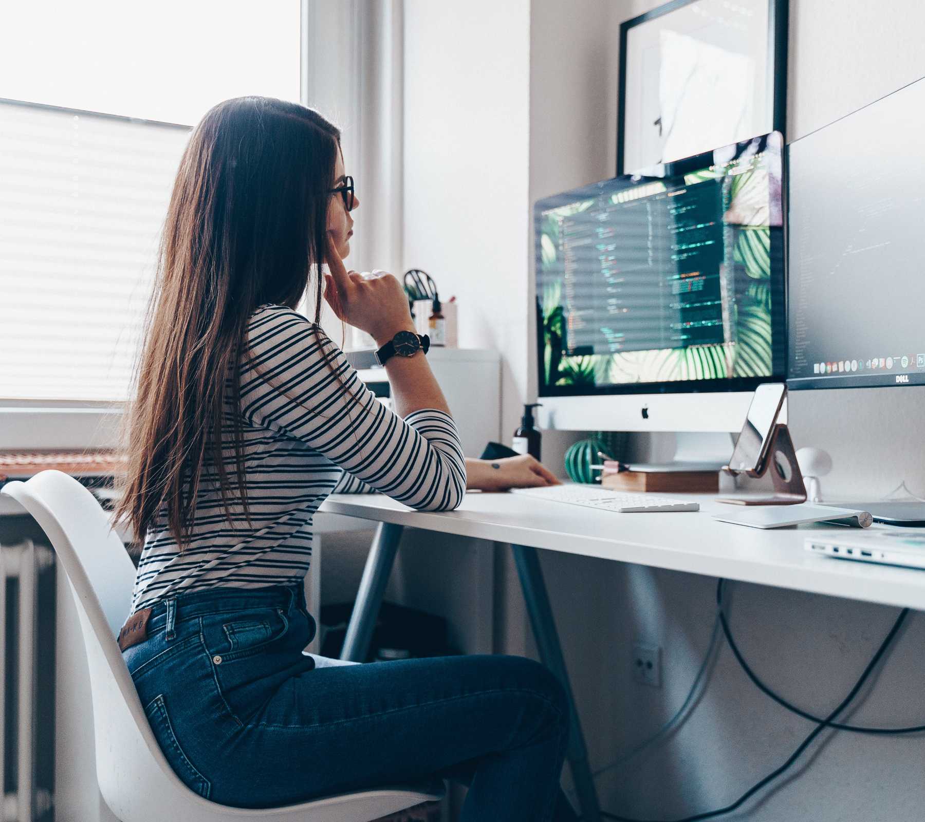 Woman working at a desk.
